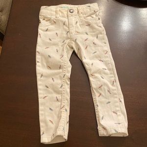 Skinny white jeans with feather print. Size 2t